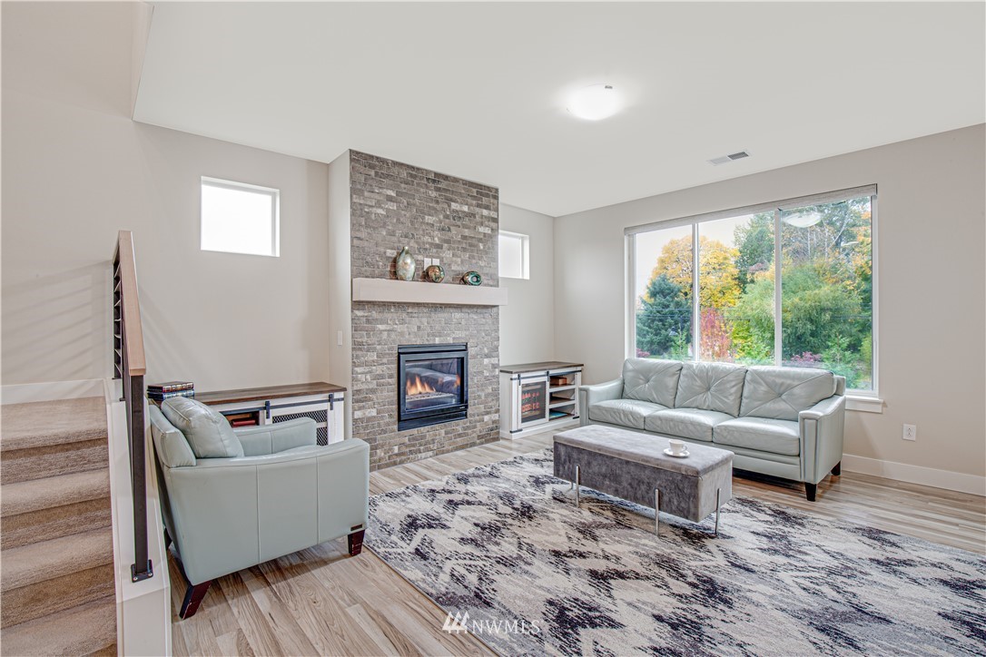 17626 115th Place Southeast Renton, WA 98055 - Photo 10 of 18 a living room with furniture and a fireplace
