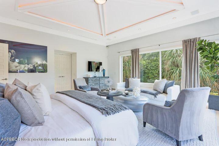 215 Indian Road Palm Beach, FL 33480 - Photo 19 of 32 a living room with furniture and a large window