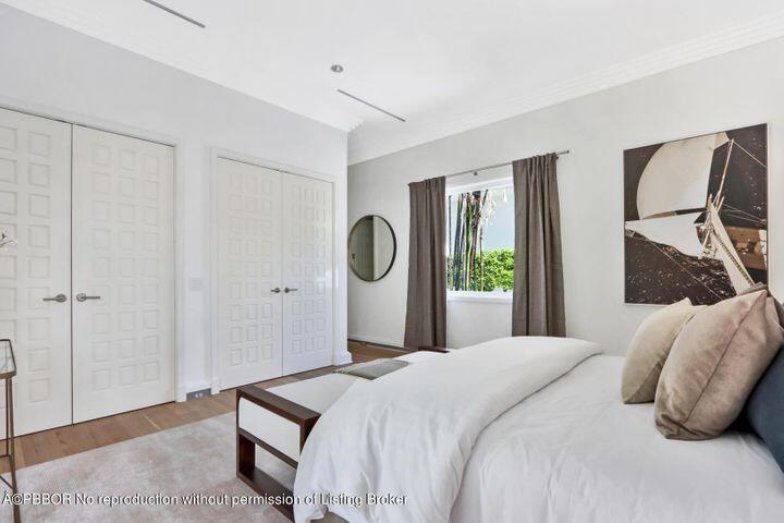215 Indian Road Palm Beach, FL 33480 - Photo 20 of 32 a bedroom with a bed and a window