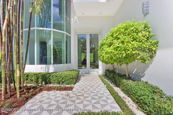 215 Indian Road Palm Beach, FL 33480 - Photo 2 of 32 a view of a garden with pathway