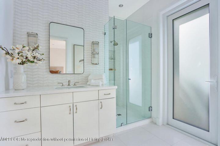 215 Indian Road Palm Beach, FL 33480 - Photo 22 of 32 a bathroom with a shower sink and mirror