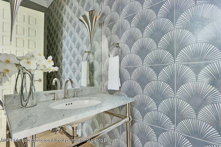 215 Indian Road Palm Beach, FL 33480 - Photo 24 of 32 a bathroom with a sink and mirror
