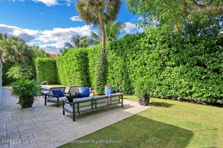 215 Indian Road Palm Beach, FL 33480 - Photo 29 of 32 a backyard view with a garden and entertaining space