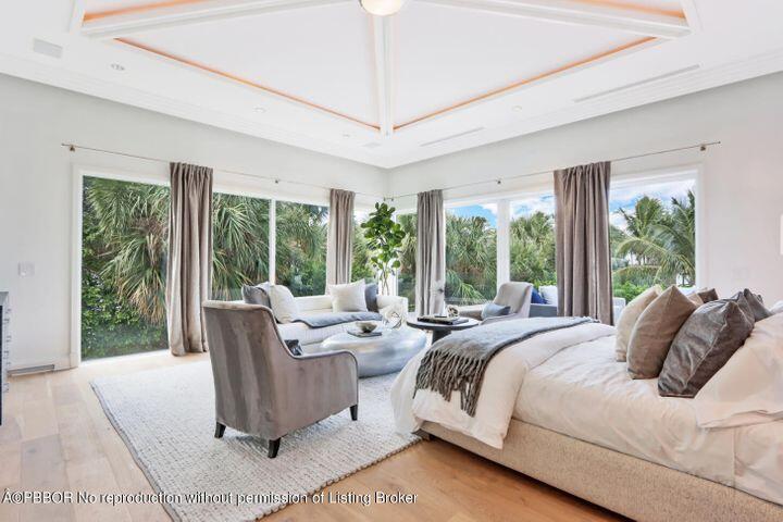215 Indian Road Palm Beach, FL 33480 - Photo 10 of 32 a bedroom with a bed and large windows