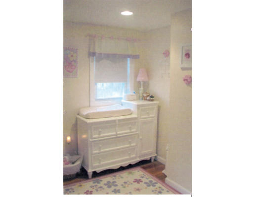 23 Corthell Road Billerica, MA 01862 - Photo 3 of 4 a bathroom with a sink a mirror and a vanity