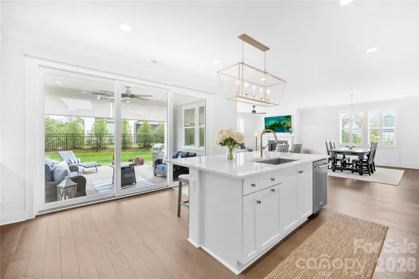 a very nice looking living room with a large window and furniture