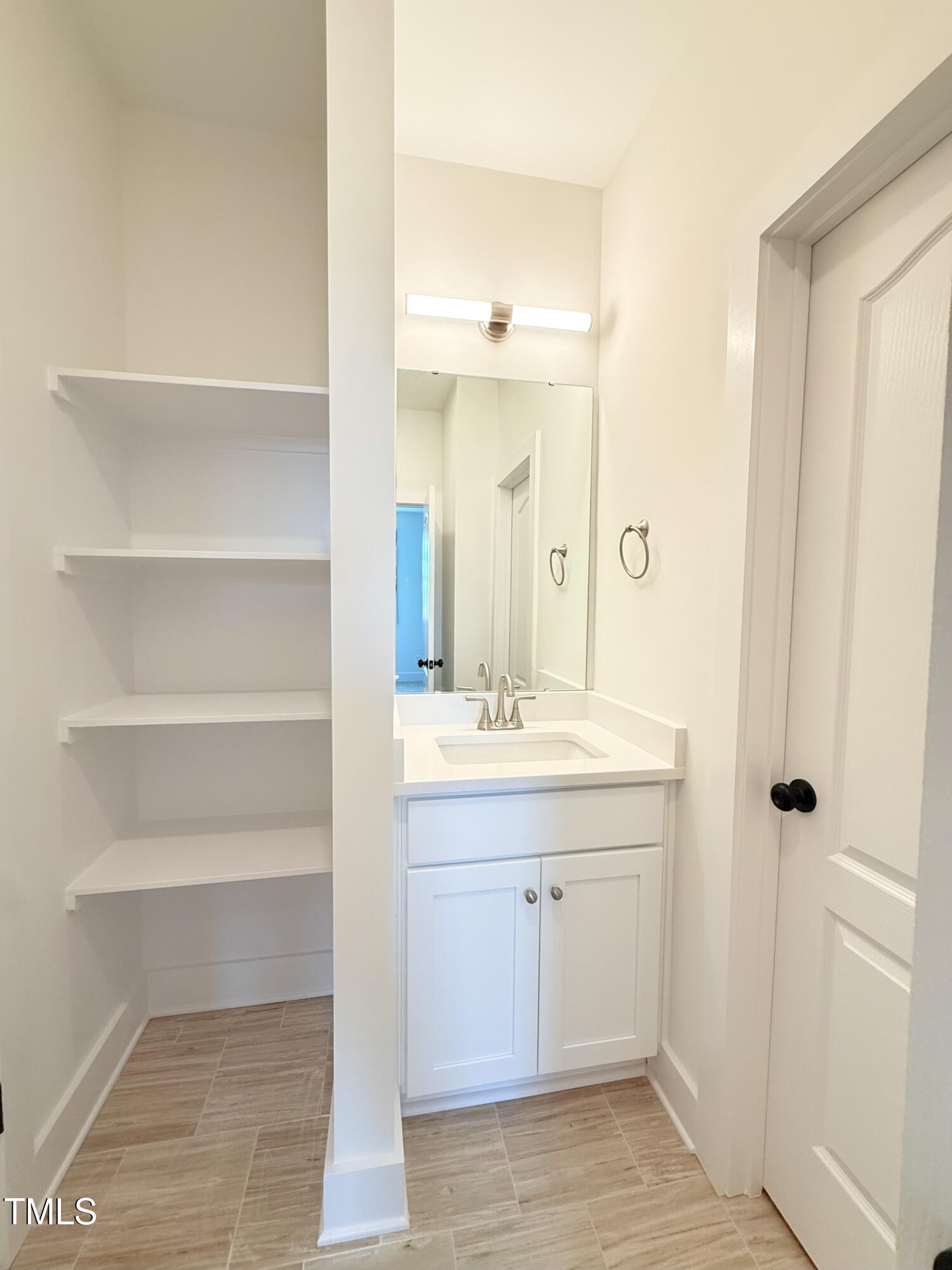 5600 River Buck Rd Spring Spring Hope, NC 27882 - Photo 13 of 31 a bathroom with a sink and a mirror