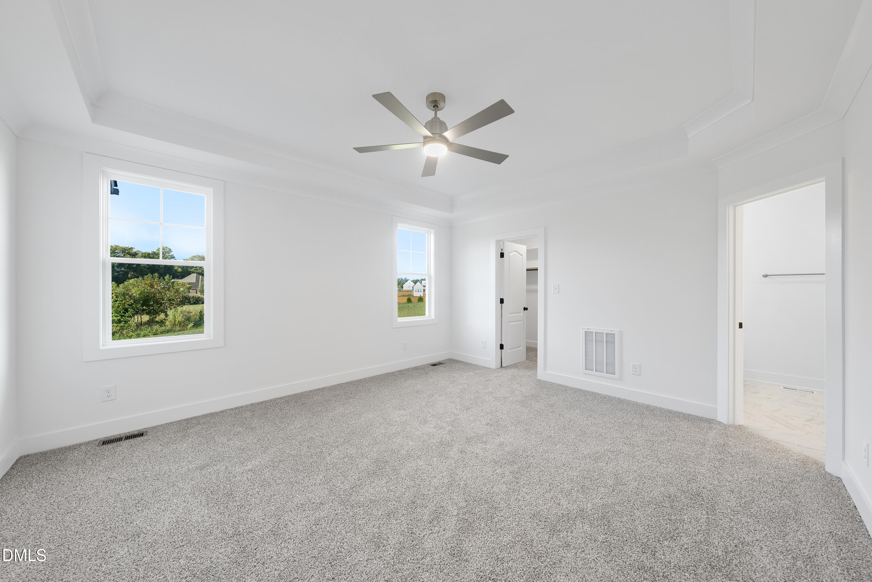 5600 River Buck Rd Spring Spring Hope, NC 27882 - Photo 16 of 31 an empty room with windows and fan chandelier fan