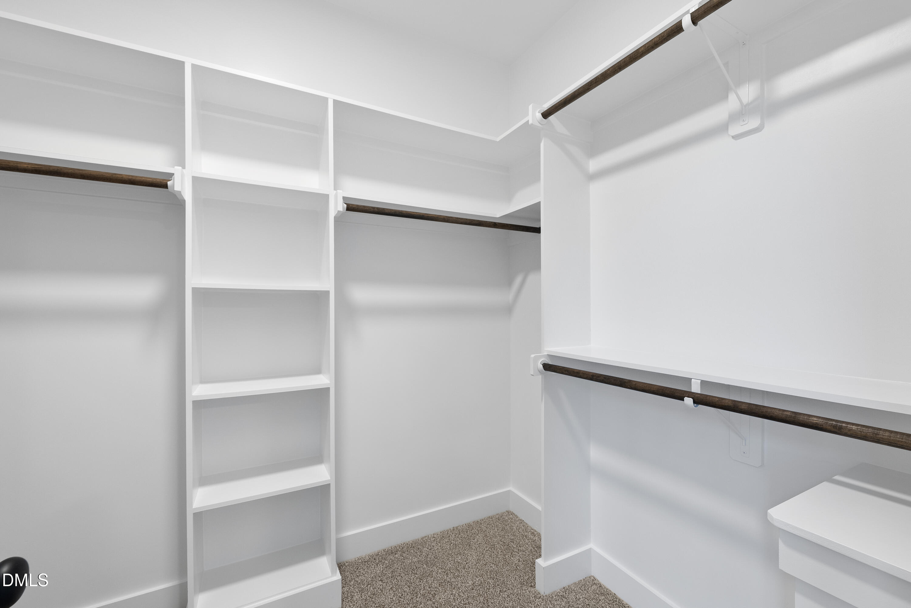 5600 River Buck Rd Spring Spring Hope, NC 27882 - Photo 21 of 31 a view of walk in closet with empty racks