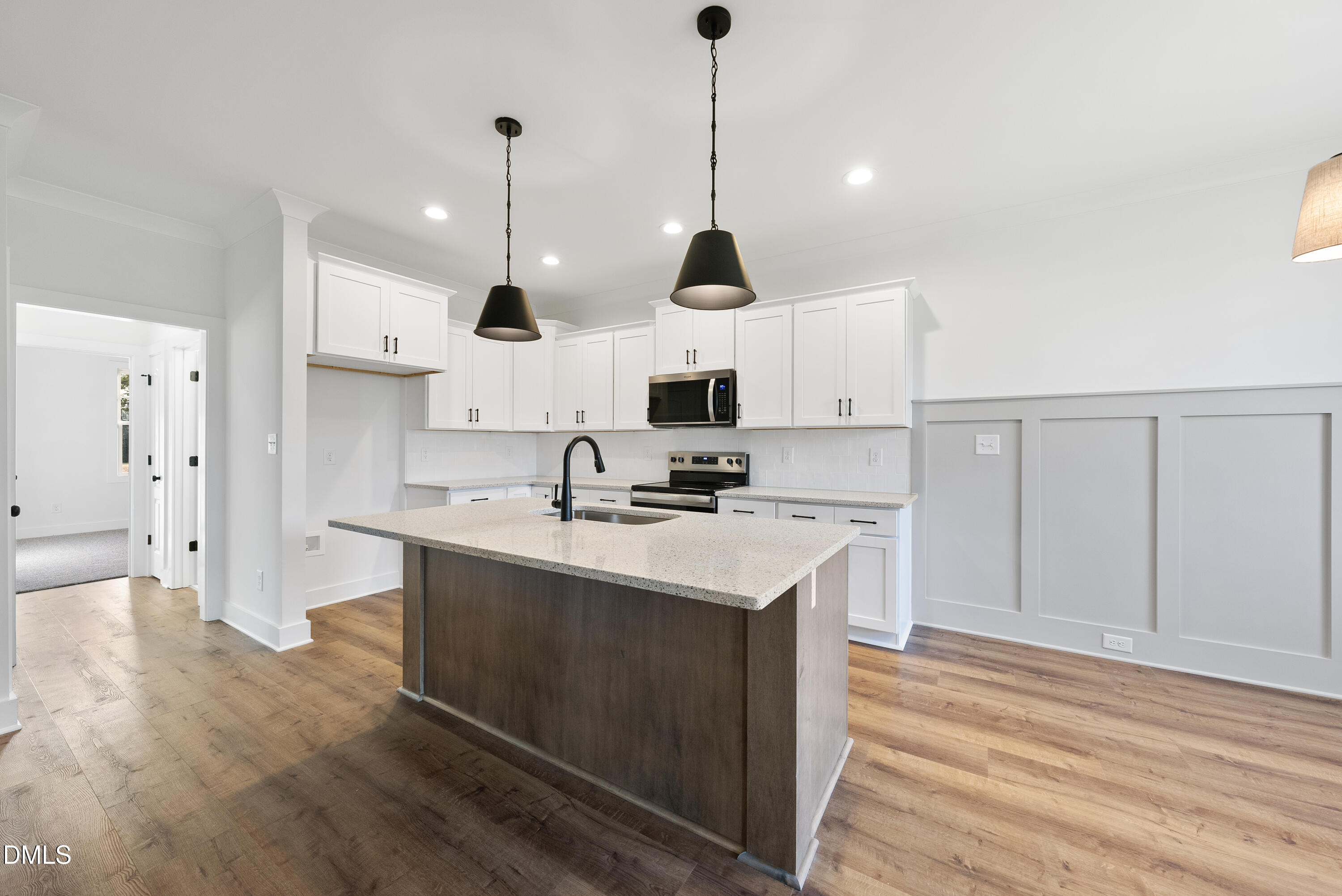 5600 River Buck Rd Spring Spring Hope, NC 27882 - Photo 7 of 31 a kitchen with kitchen island a sink stainless steel appliances and cabinets
