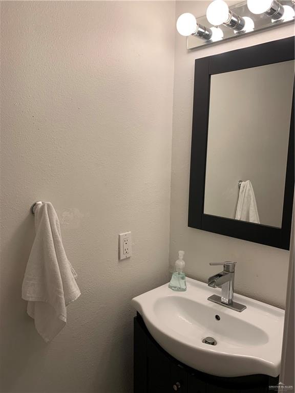 2201 South Jackson Road, Unit 35 Pharr, TX 78577 - Photo 13 of 21 a bathroom with a sink and a mirror