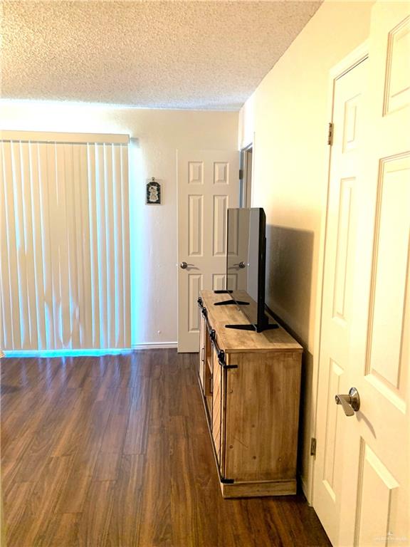 2201 South Jackson Road, Unit 35 Pharr, TX 78577 - Photo 15 of 21 a view of a kitchen with wooden floor and a sink