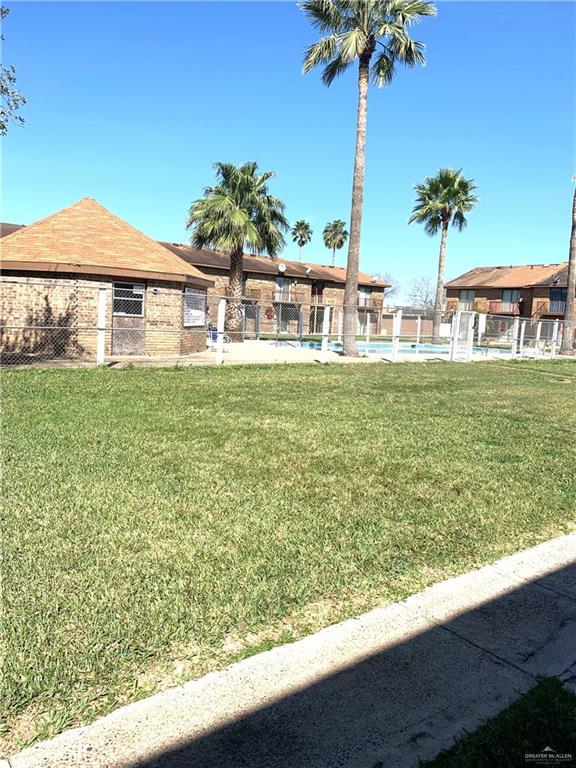 2201 South Jackson Road, Unit 35 Pharr, TX 78577 - Photo 21 of 21 a view of a house with a yard and potted plants