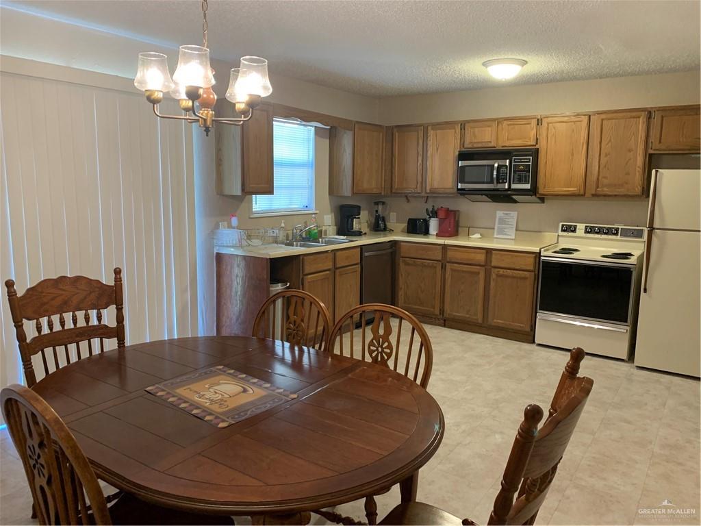 2201 South Jackson Road, Unit 35 Pharr, TX 78577 - Photo 5 of 21 a view of a dining room with furniture