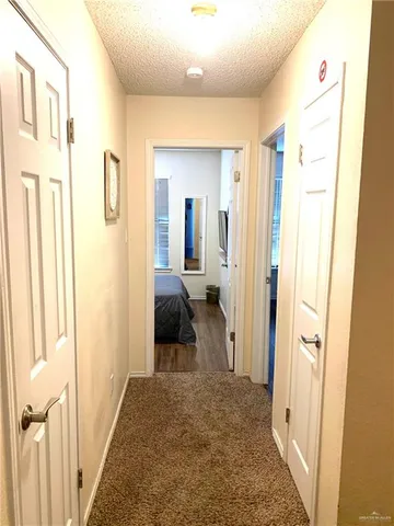 a view of a bathroom with sink and mirror