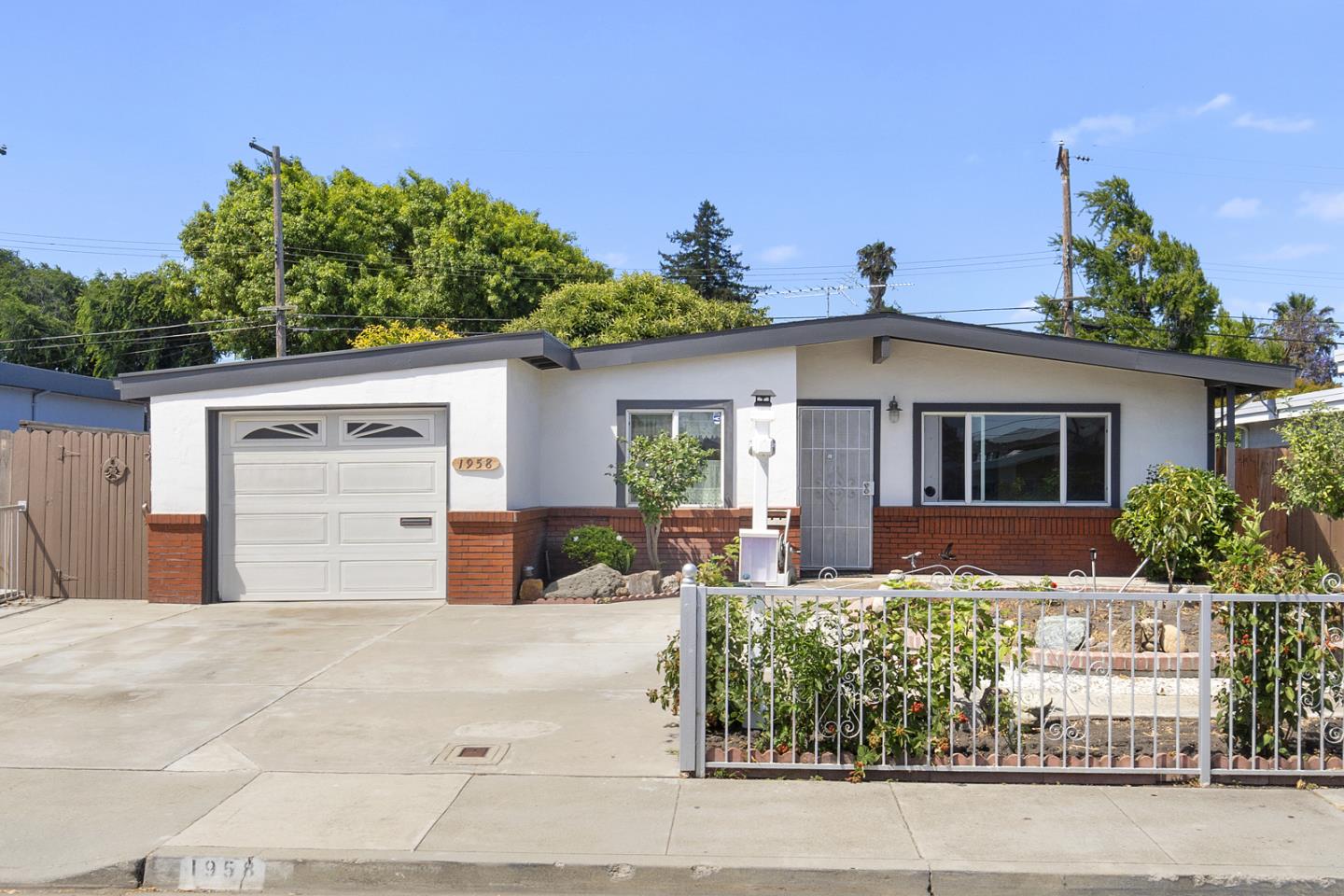 1958 Jackson Street Santa Clara, CA 95050 - Photo 1 of 22 a front view of a house with garden