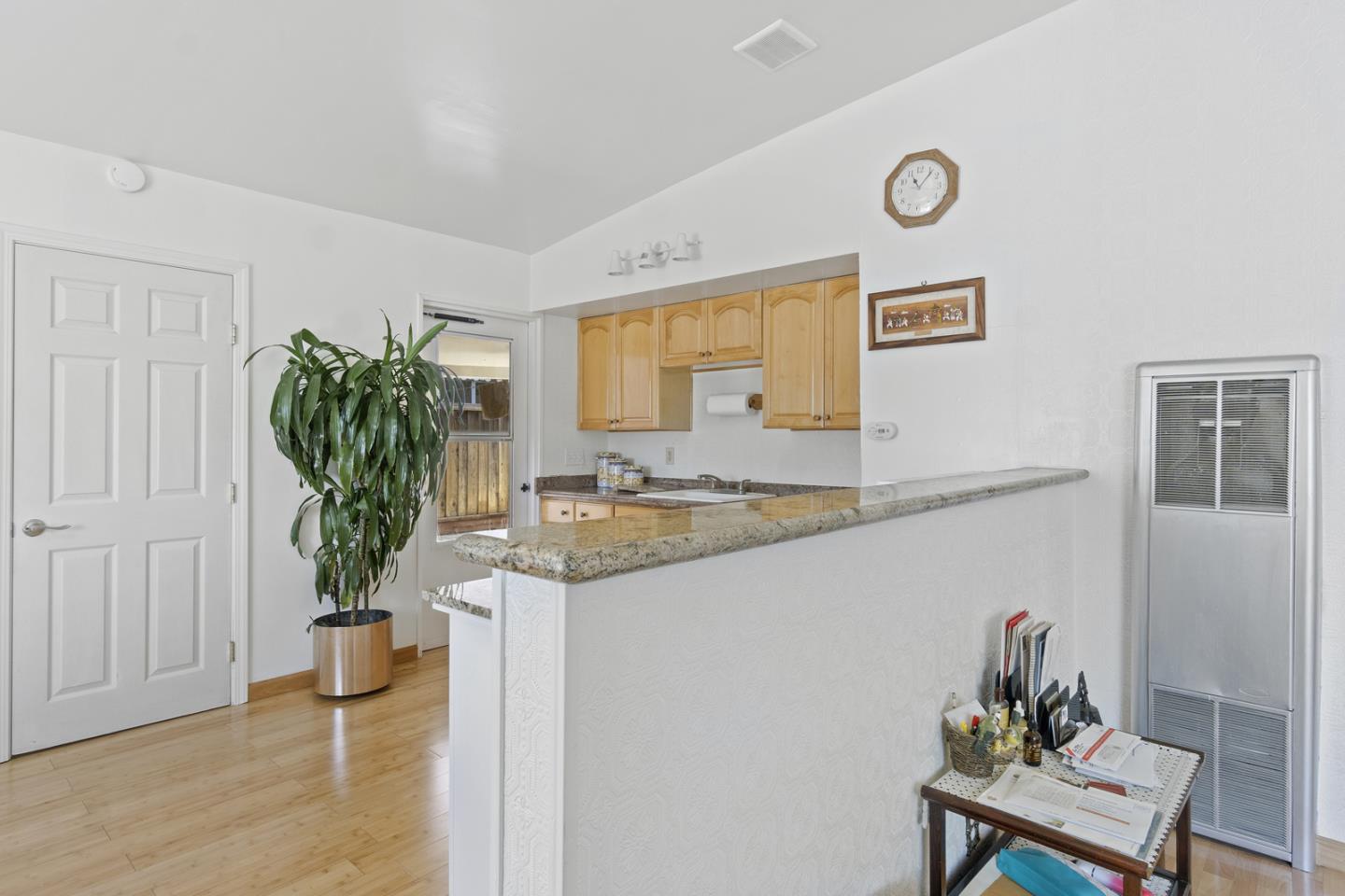 1958 Jackson Street Santa Clara, CA 95050 - Photo 12 of 22 a kitchen with a potted plant on the counter and cabinets