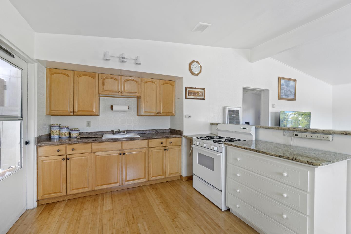 1958 Jackson Street Santa Clara, CA 95050 - Photo 10 of 22 a kitchen with granite countertop cabinets stainless steel appliances and a wooden floor