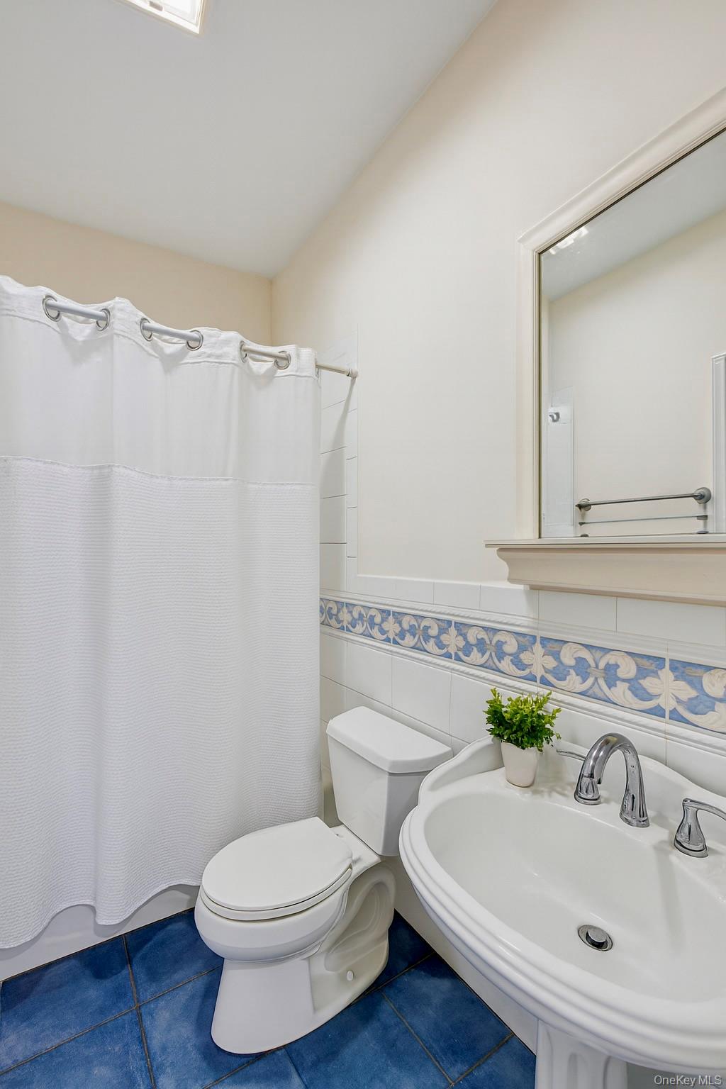 12 Laila Lane Remsenburg, NY 11960 - Photo 23 of 50 A beautifully appointed full en suite bath designed for relaxation and convenience.