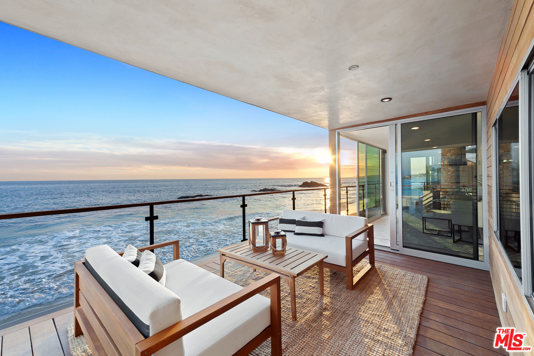 24928 Malibu Road Malibu, CA 90265 - Photo 13 of 20 a terrace with outdoor seating and city view