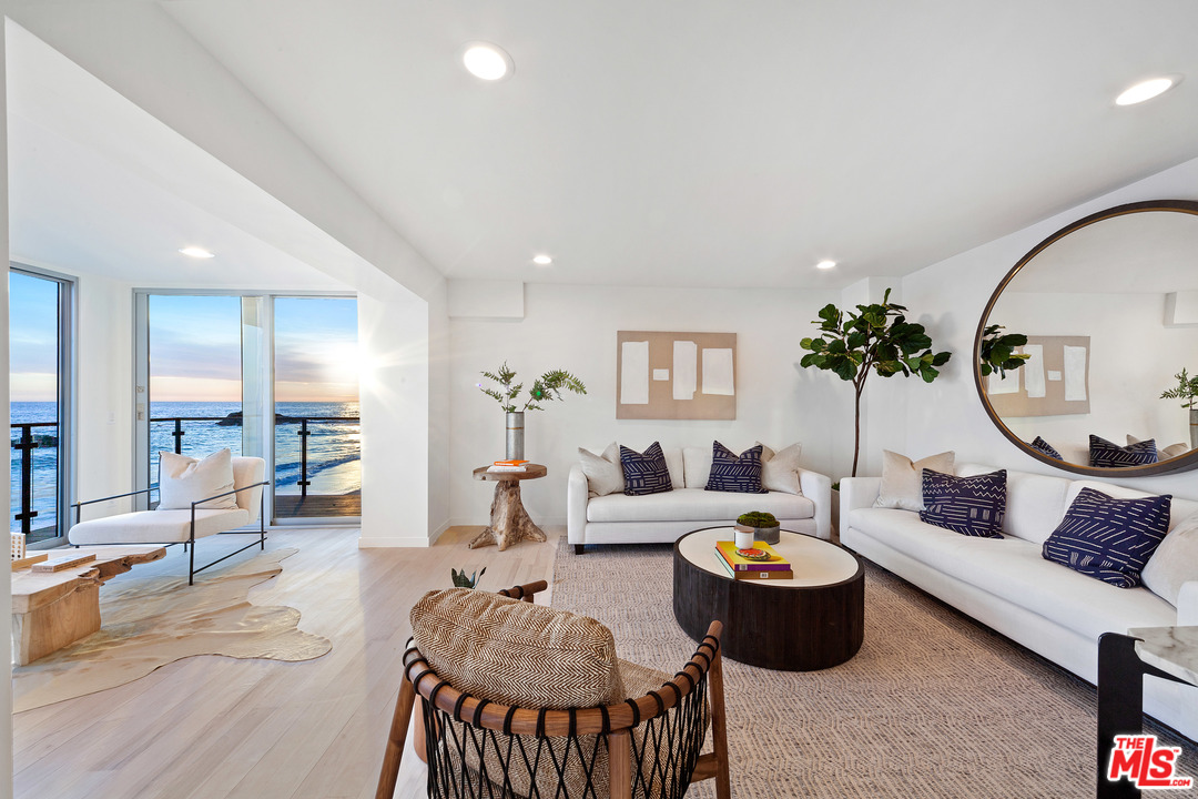 24928 Malibu Road Malibu, CA 90265 - Photo 16 of 20 a living room with furniture and a large mirror
