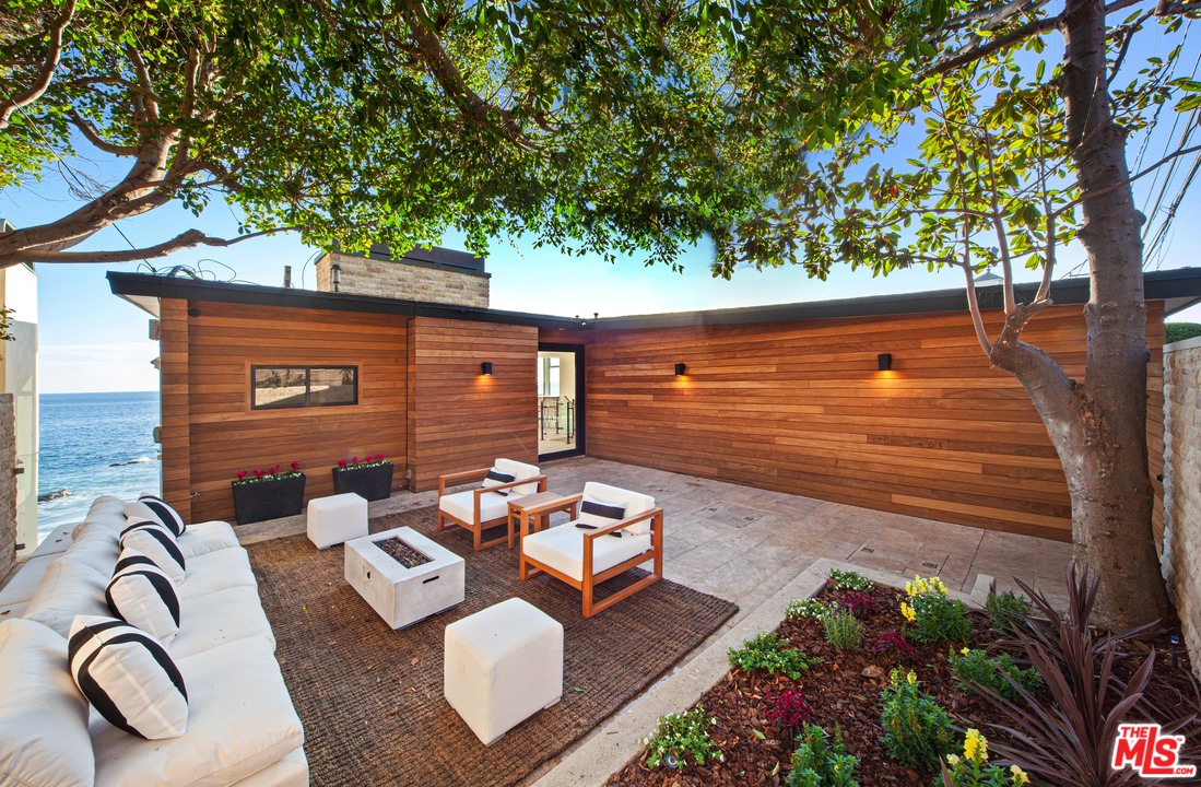 24928 Malibu Road Malibu, CA 90265 - Photo 20 of 20 a backyard of a house with seating space