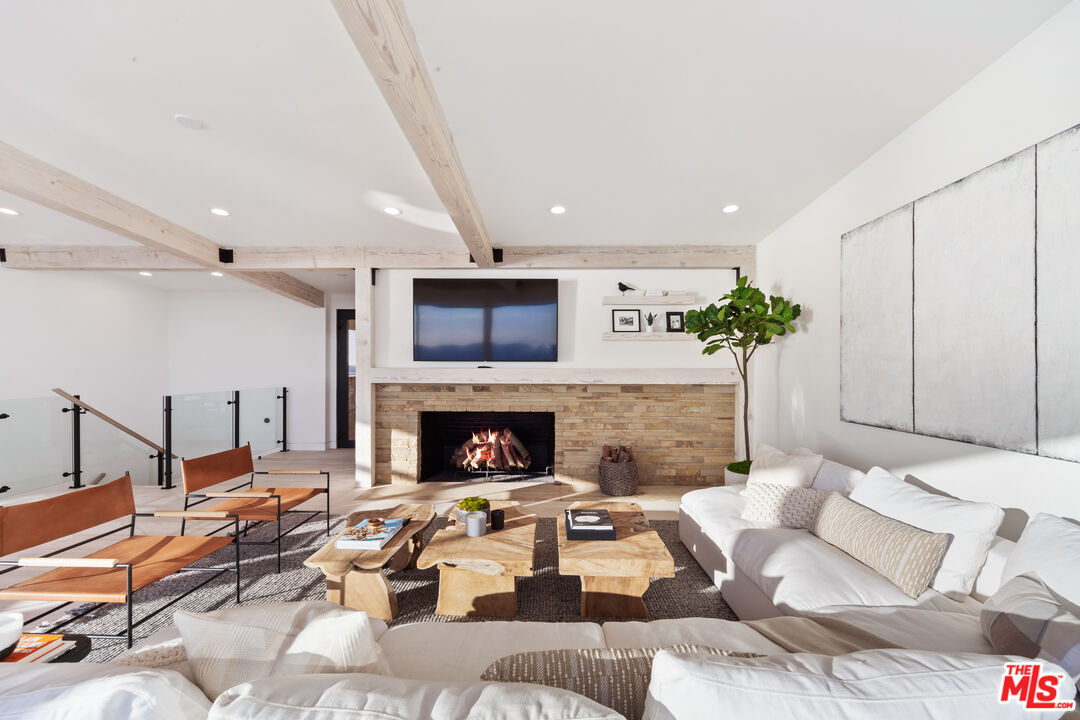 24928 Malibu Road Malibu, CA 90265 - Photo 7 of 20 a living room with fireplace furniture and a fireplace