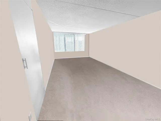 a view of a room with a kitchen