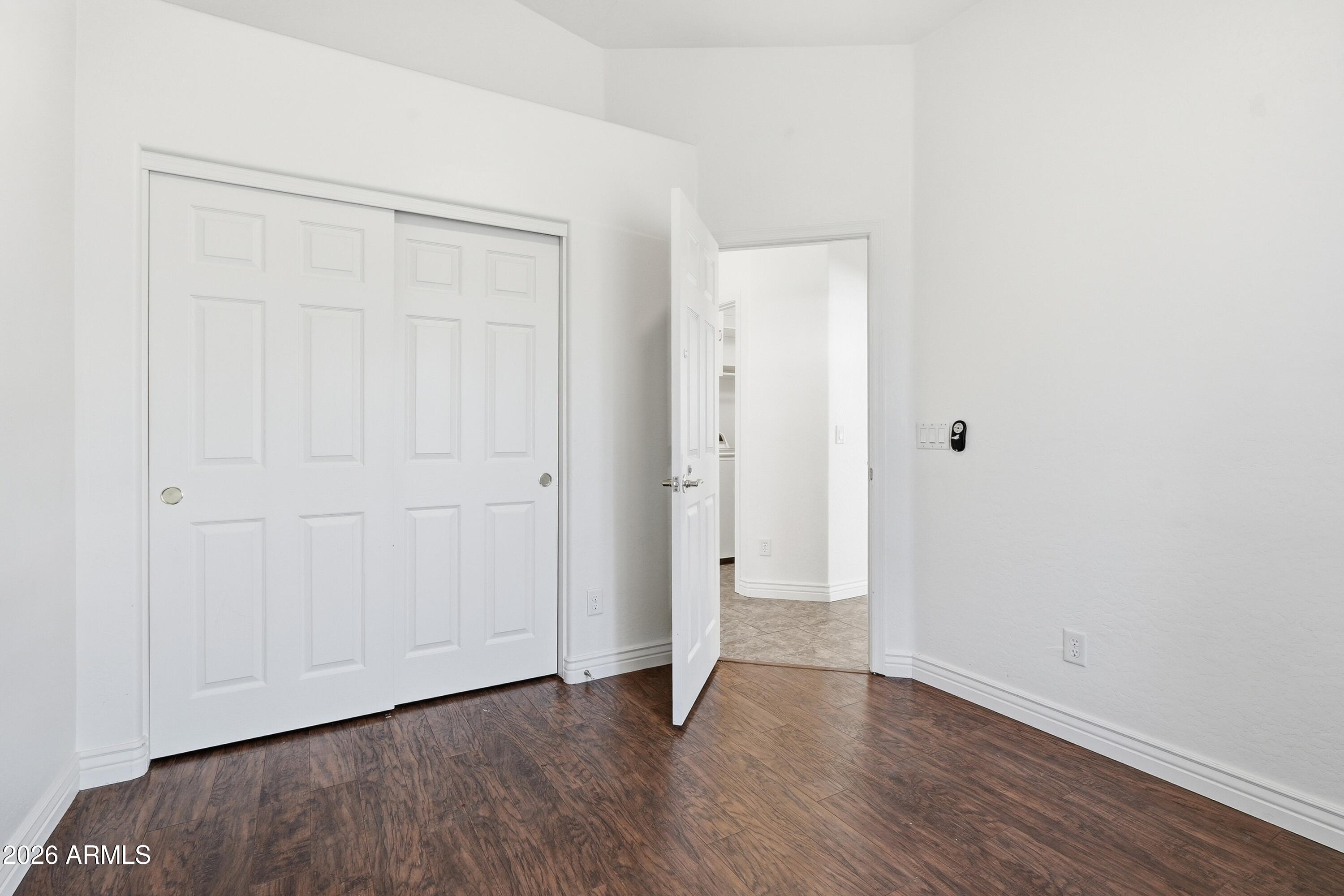 3242 East Bonanza Road Gilbert, AZ 85297 - Photo 20 of 36 a view of an empty room with wooden floor