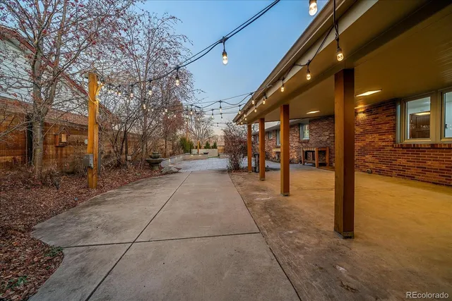 a view of a patio with a yard