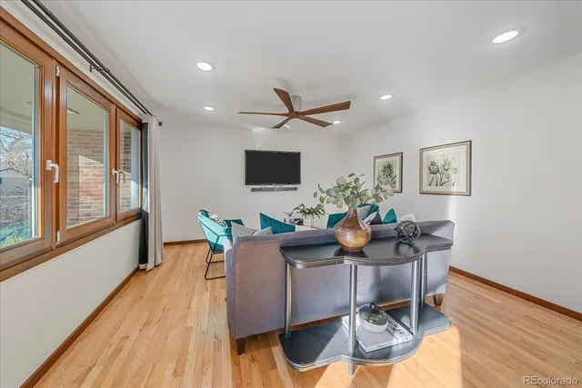 a workspace with furniture and a wooden floor