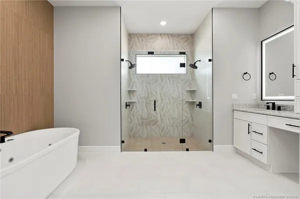 a bathroom with a bathtub and a sink