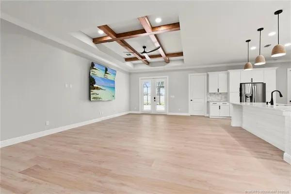 a view of a livingroom with a fireplace furniture and a ceiling fan