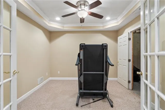 a view of a hallway with wooden floor and stairs