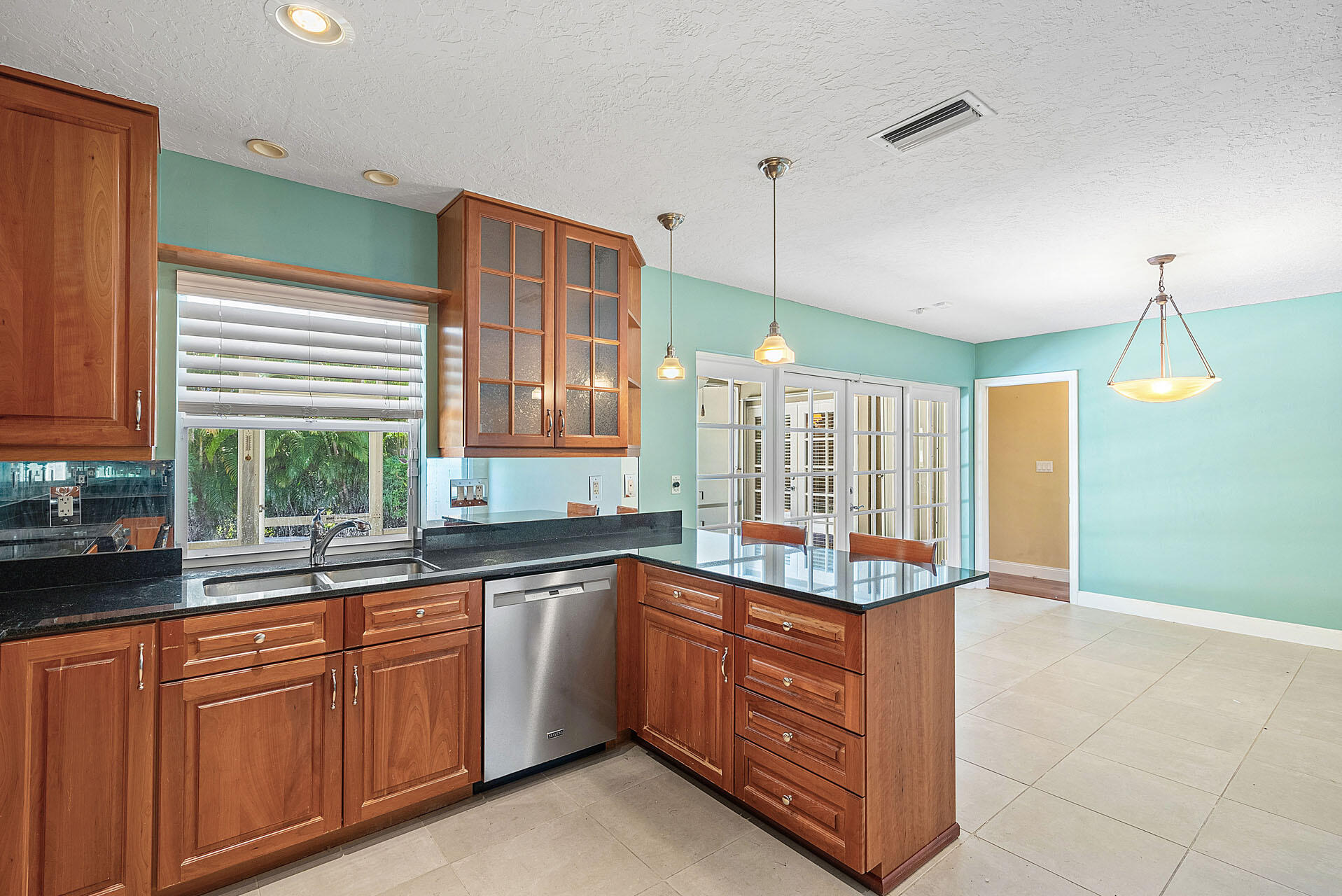 220 Southwest 9th Avenue Boca Raton, FL 33486 - Photo 15 of 42 a kitchen with a sink and cabinets