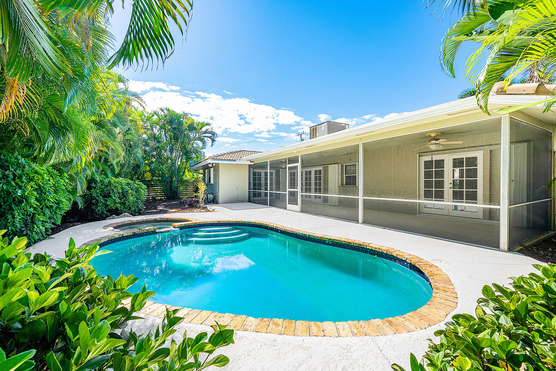 220 Southwest 9th Avenue Boca Raton, FL 33486 - Photo 22 of 42 a view of an house with swimming pool and porch