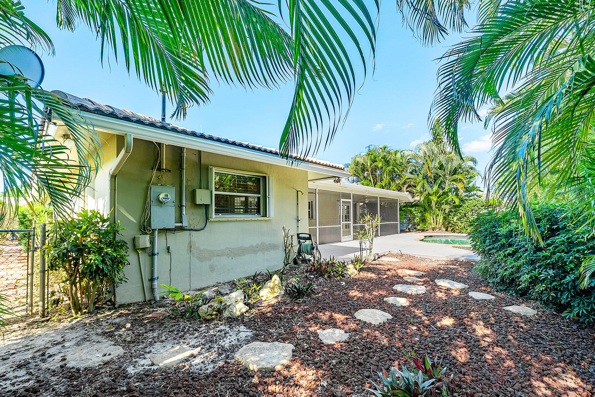 220 Southwest 9th Avenue Boca Raton, FL 33486 - Photo 24 of 42 a front view of a house with a garden