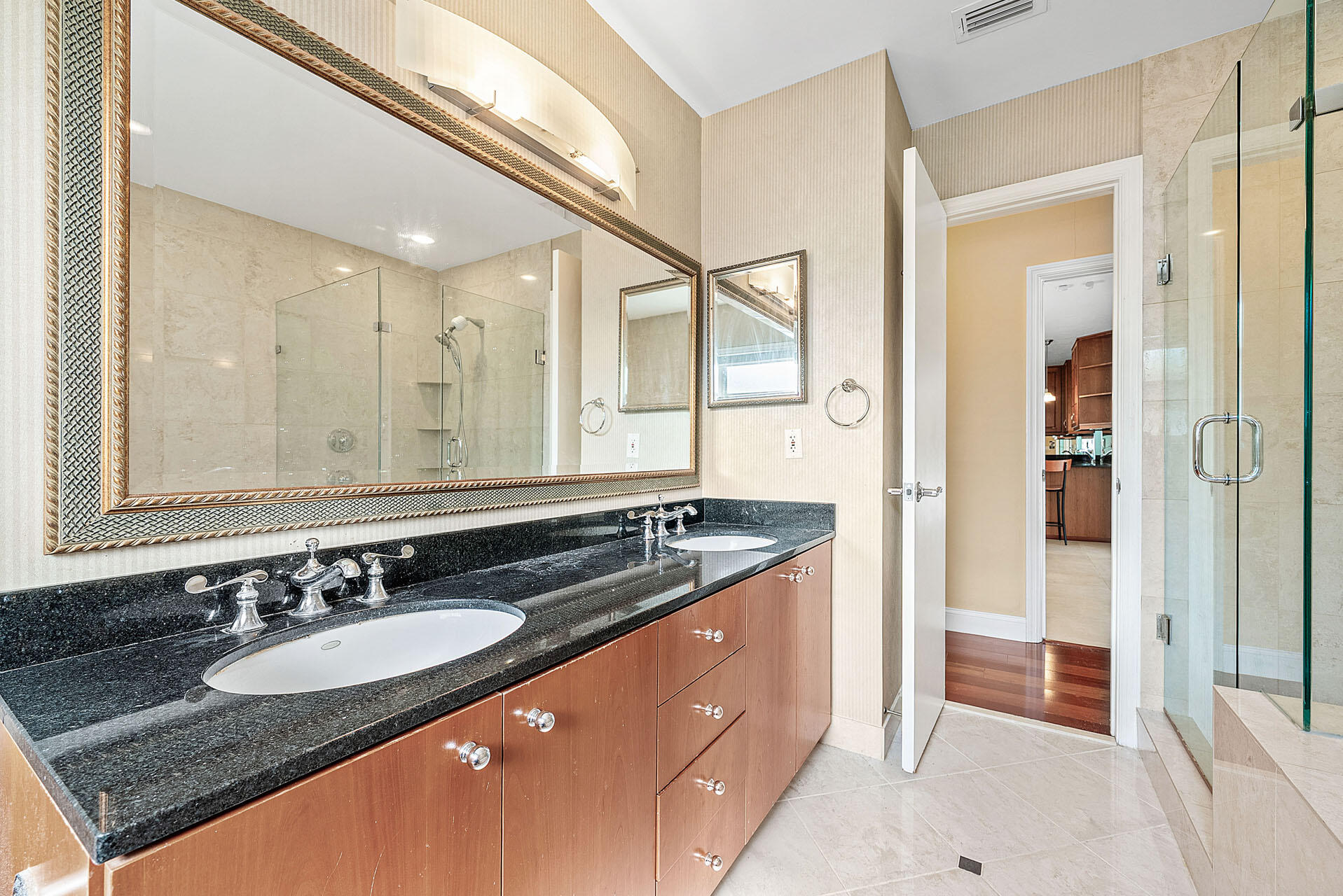 220 Southwest 9th Avenue Boca Raton, FL 33486 - Photo 28 of 42 a bathroom with a granite countertop sink and a mirror