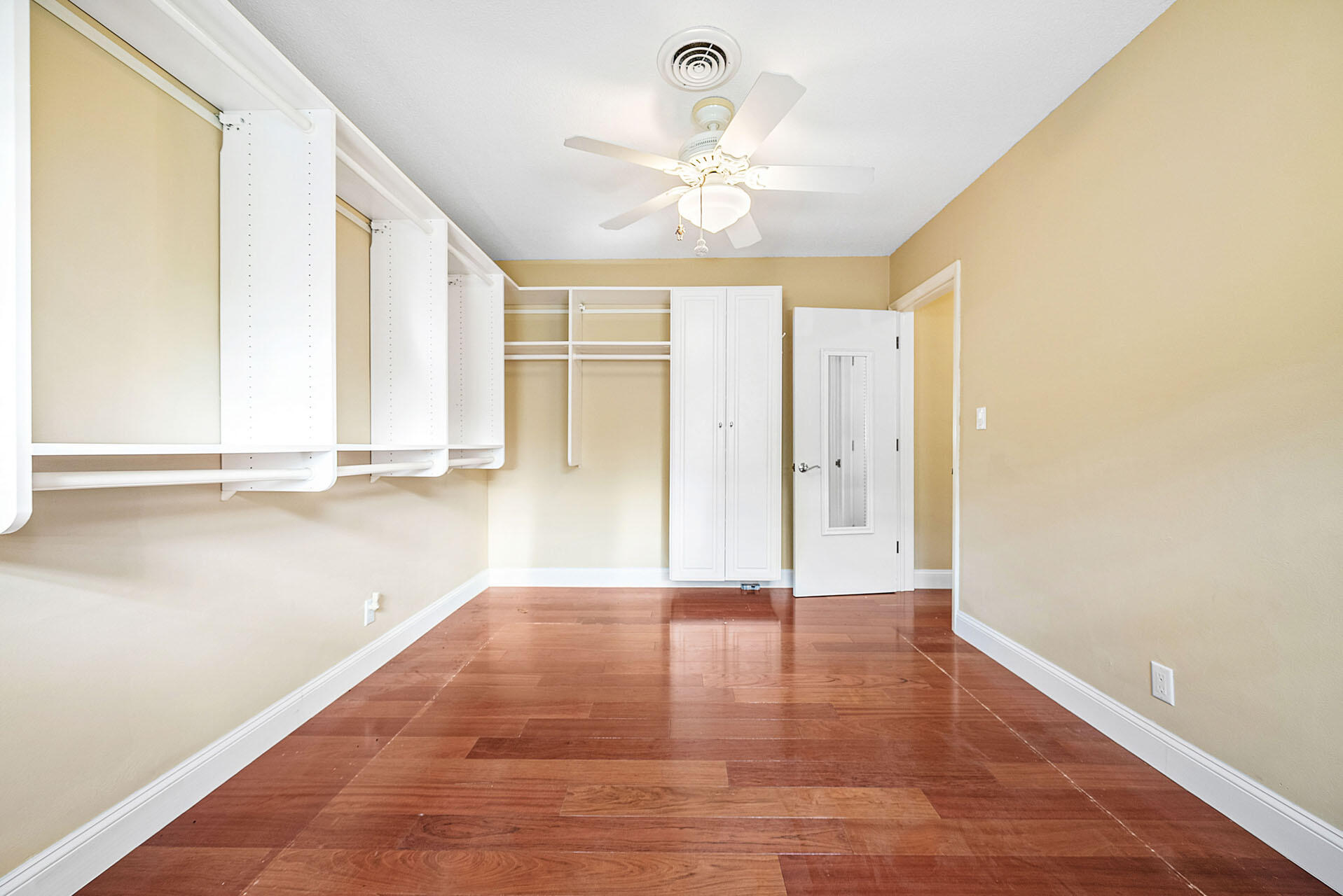 220 Southwest 9th Avenue Boca Raton, FL 33486 - Photo 30 of 42 a view of an empty room with window and wooden floor