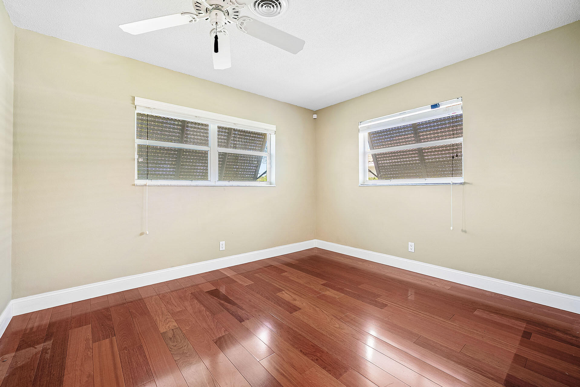 220 Southwest 9th Avenue Boca Raton, FL 33486 - Photo 31 of 42 a view of empty room with wooden floor and fan