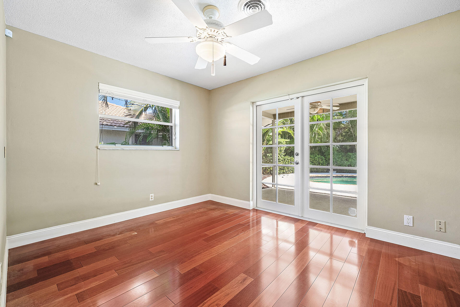 220 Southwest 9th Avenue Boca Raton, FL 33486 - Photo 33 of 42 a view of an empty room with wooden floor and a window