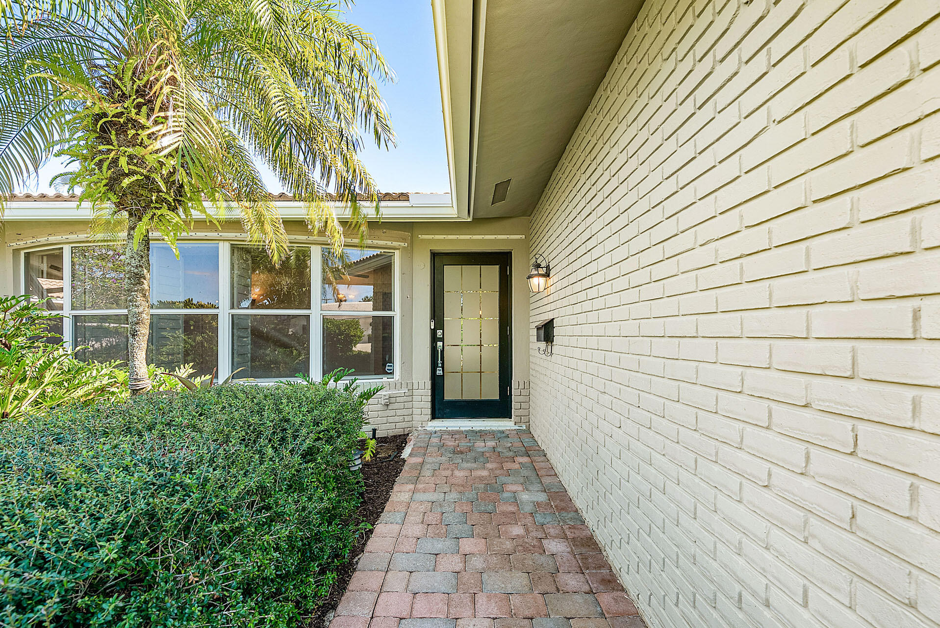 220 Southwest 9th Avenue Boca Raton, FL 33486 - Photo 6 of 42 a view of a pathway both side of house