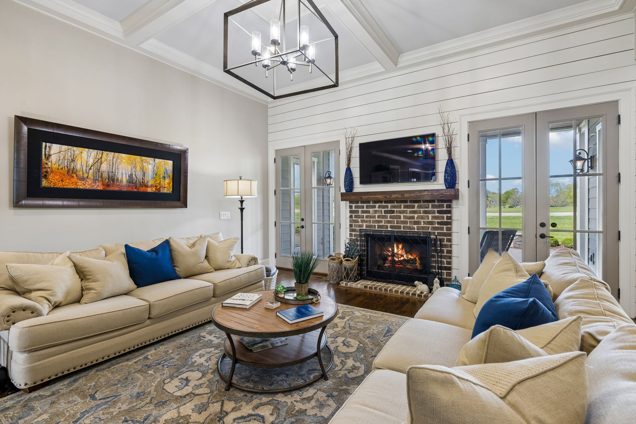 6033 Native Pony Trail College Grove, TN 37046 - Photo 21 of 87 a living room with furniture a fireplace and a flat screen tv