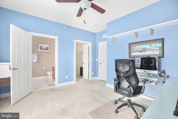 a work room with furniture and a window