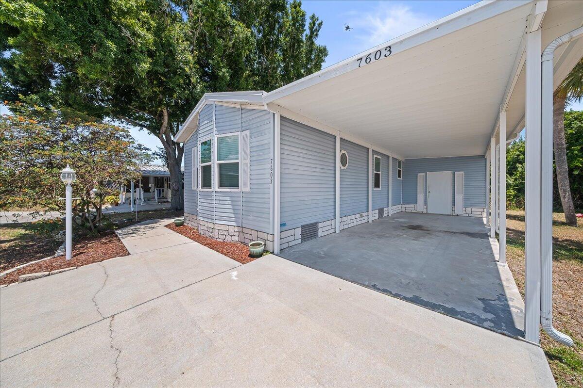 7603 Boxelder Road, Unit G2 Micco, FL 32976 - Photo 3 of 30 Carport