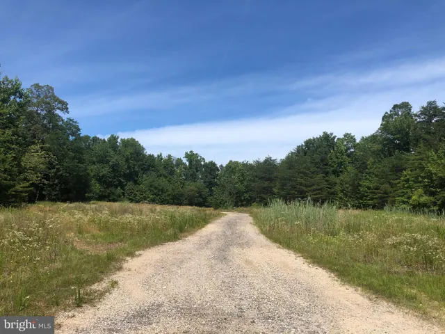 a view of a lake with a yard