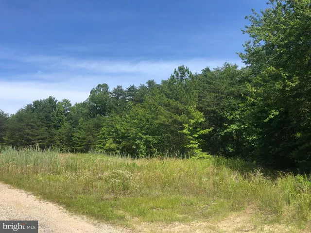 a view of lake with green space