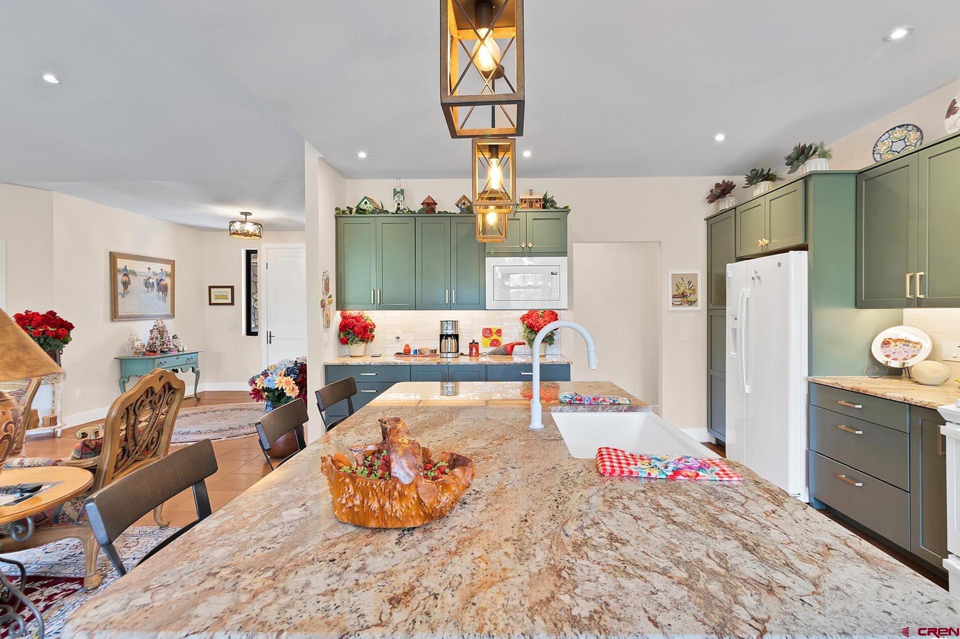 1470 Southeast Stonebridge Drive Cedaredge, CO 81413 - Photo 16 of 42 a bedroom with a bed and wooden floor