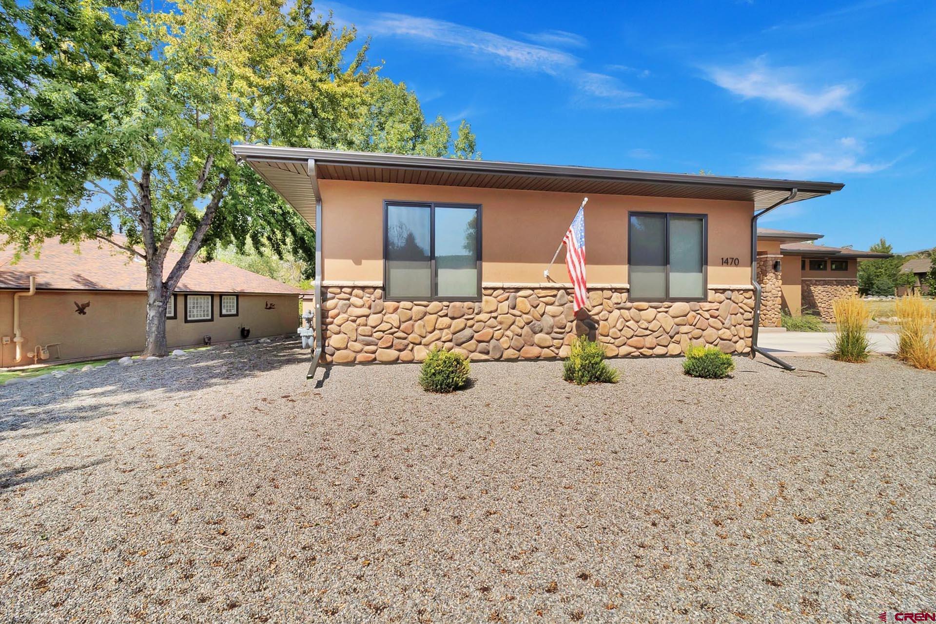 1470 Southeast Stonebridge Drive Cedaredge, CO 81413 - Photo 34 of 42 front view of a house with a patio