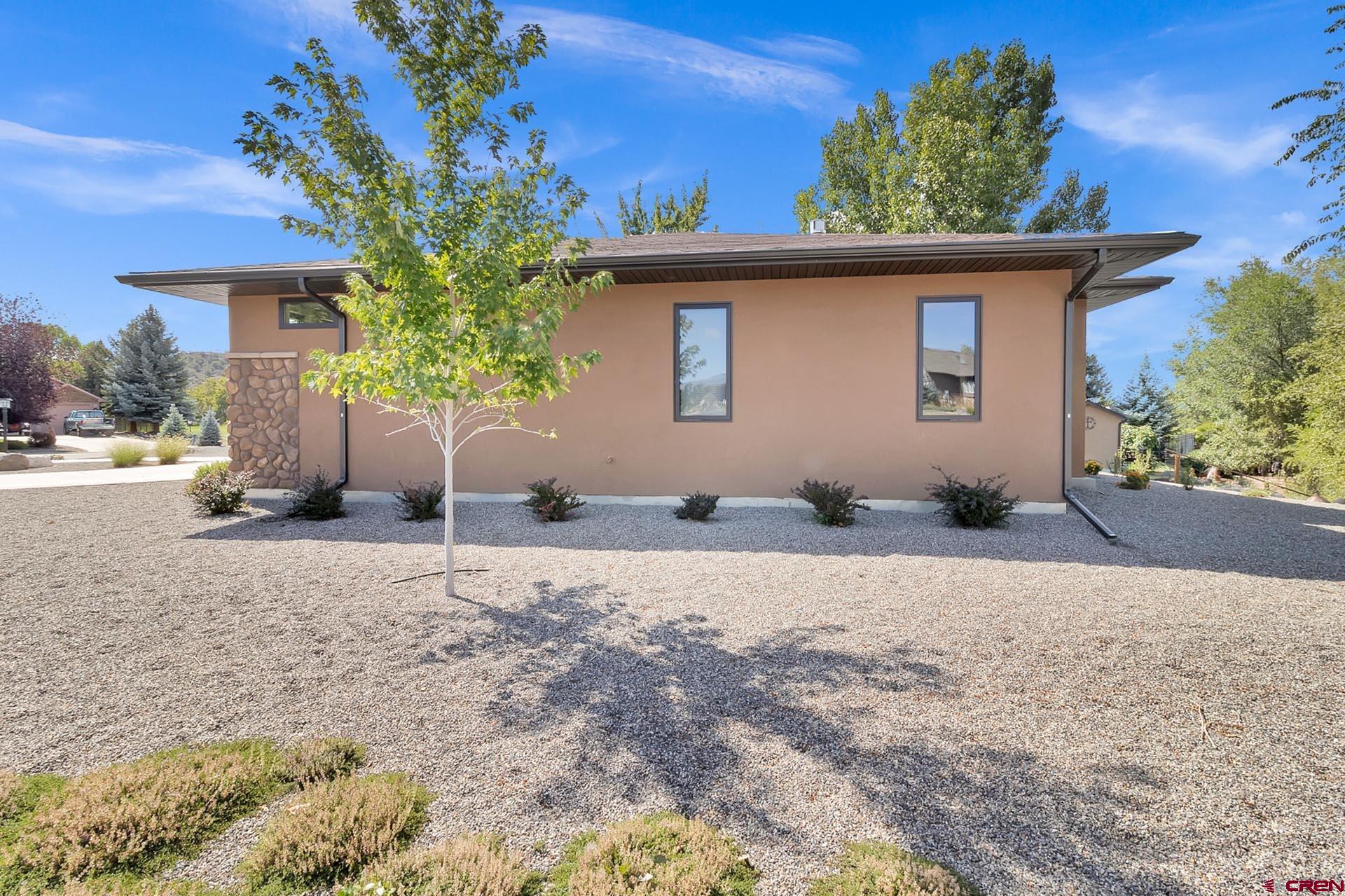1470 Southeast Stonebridge Drive Cedaredge, CO 81413 - Photo 35 of 42 a front view of a house with a yard